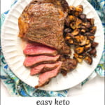 large ribeye steak sliced with garlic mushrooms on white plate with text overlay