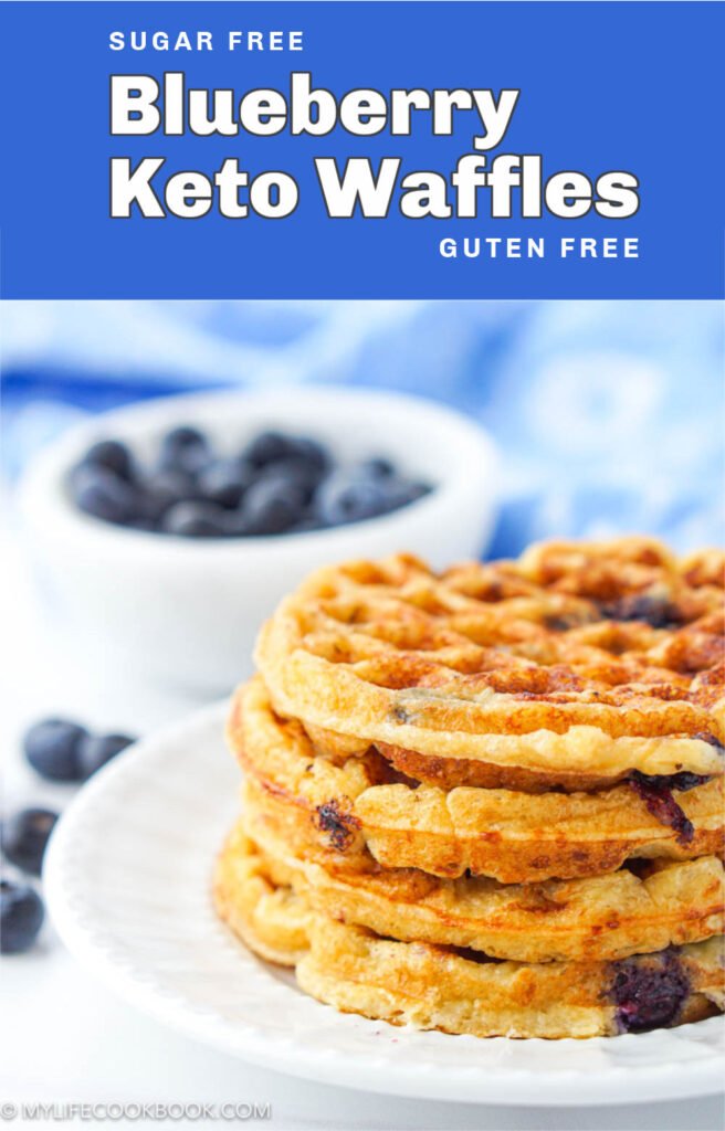 closeup of a white plate with a stack of keto blueberry waffles and fresh blueberries in background  and text