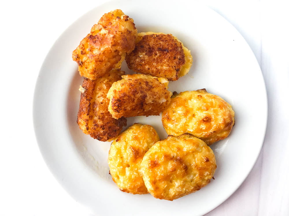 white plate with two different ways to cook the cauliflower tots