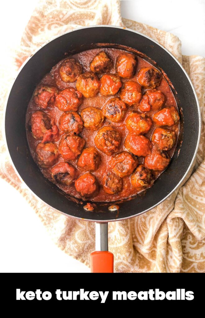 closeup of pan with meatballs and sauce that are low carb with text overlay