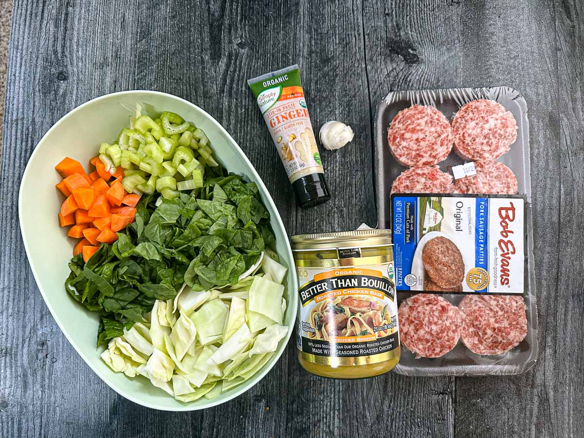 Recipe ingredients - chopped vegetables, ginger, garlic, better than bouillon and sausage.