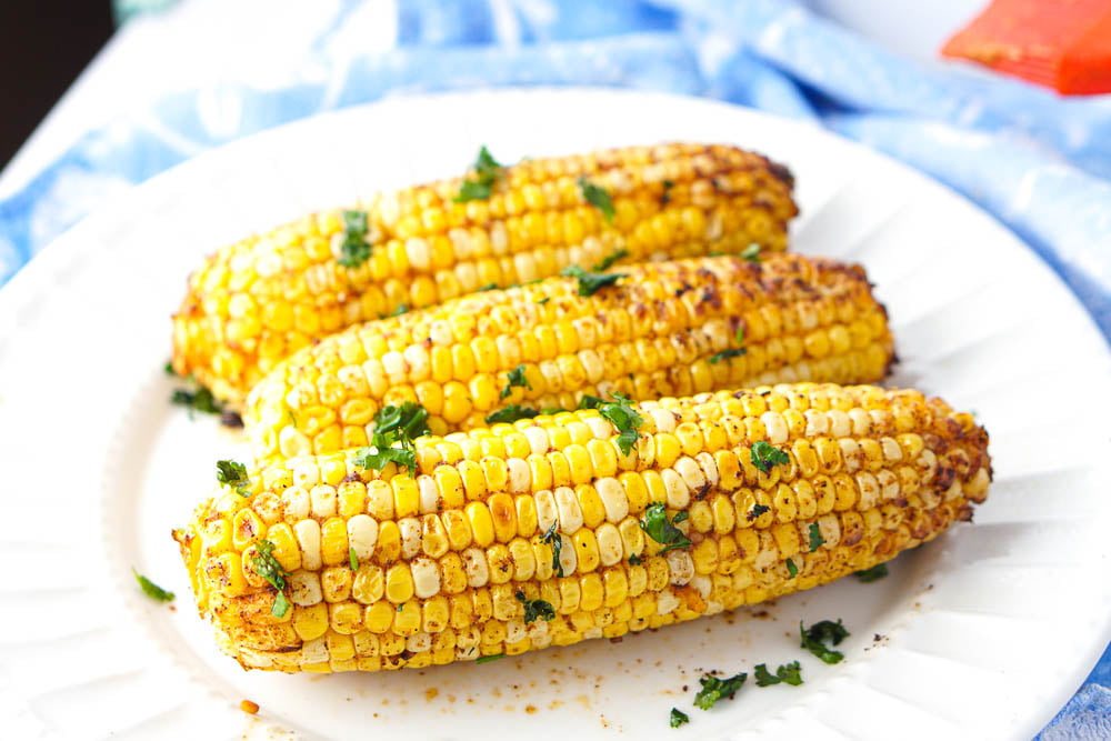 3 ears of corn with spices and cilantro 