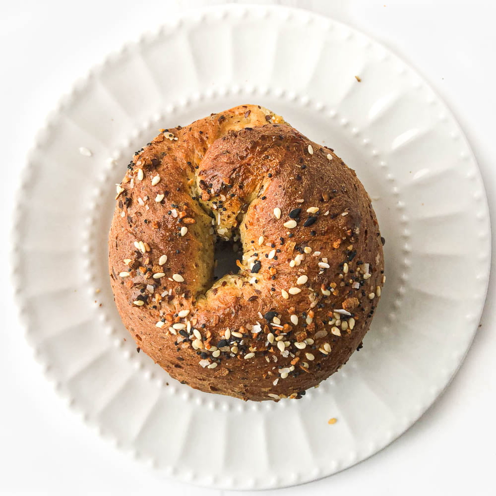 white plate with keto bagel made in air fryer