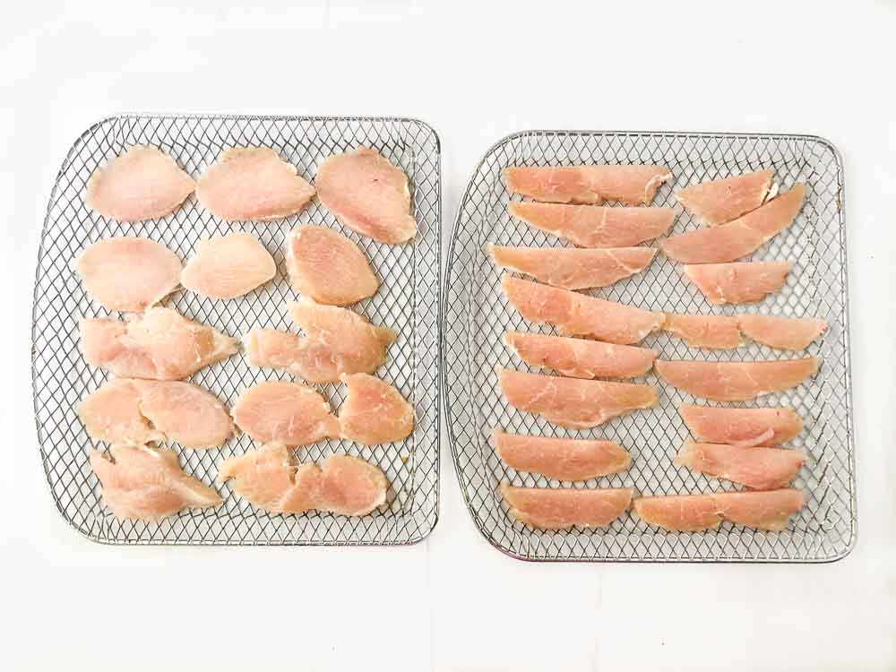air fryer trays with raw cut chicken