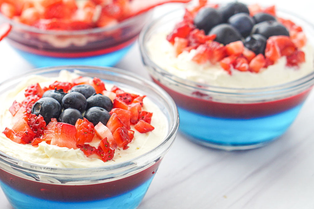 closeup of red white and blue keto jello dessert with fresh berries