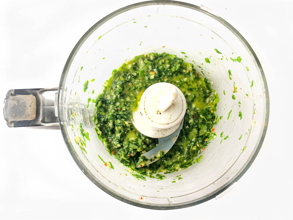 food processor bowl with green sauce