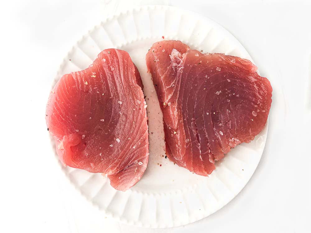 white dish with raw tuna steaks