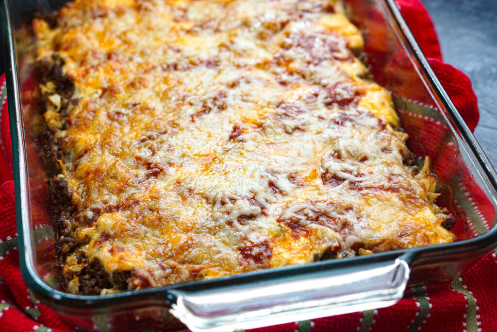 Closeup of a baking dish with the cheesy low carb Italian hamburger dish.
