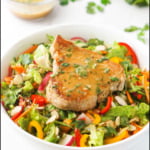 white bowl with tuna steak salad and sesame ginger dressing and text