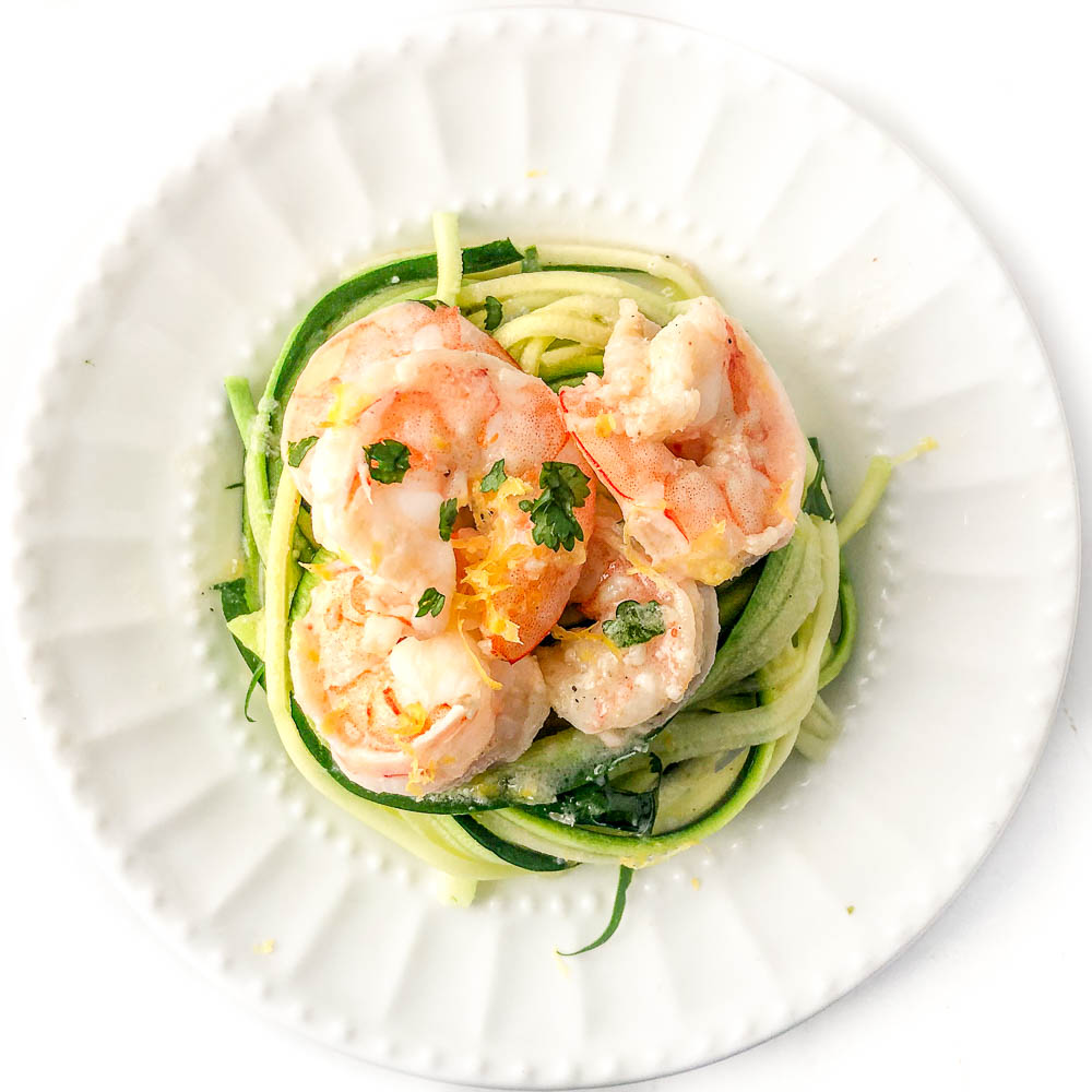 white plate with zoodles and keto shrimp scampi