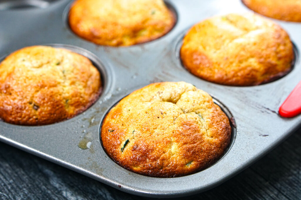 Closeup of a pan full of protein zucchini muffins.