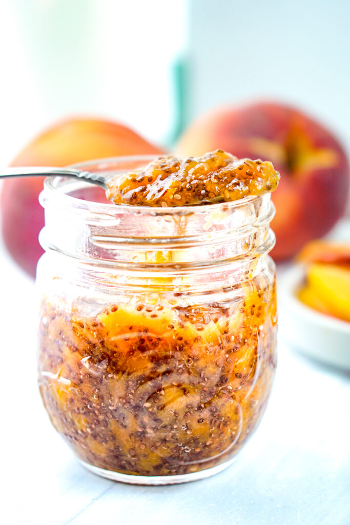 closeup of a jar with chia seed jam and peaches