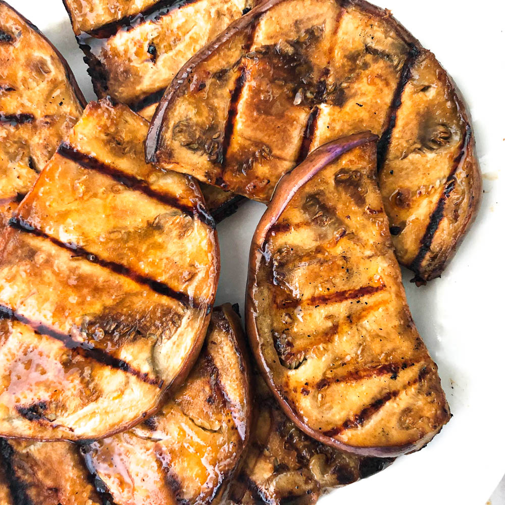 closeup of grilled slices of marinated eggplant