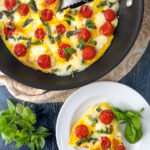 pan and white dish with keto caprese omelet