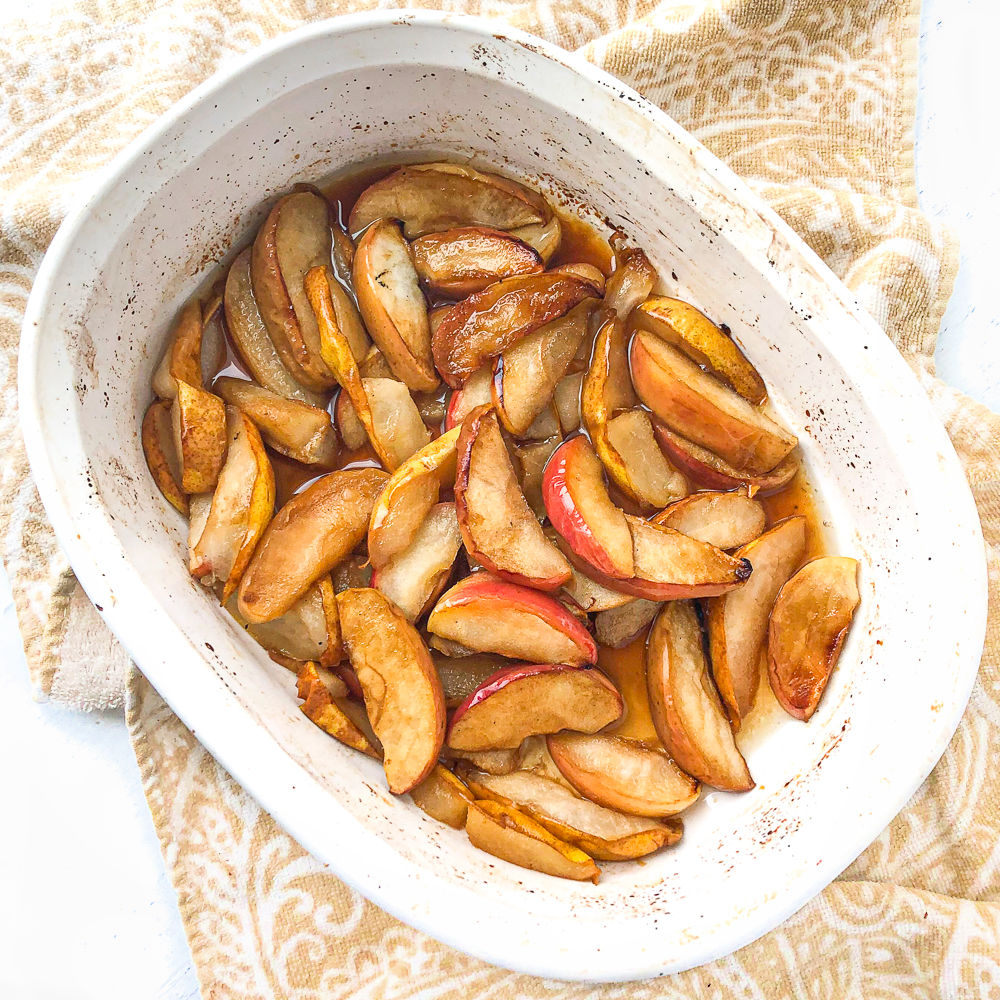 white plate with baked pear and apples