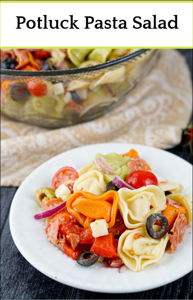 glass bowl with antipasto tortellini salad with text