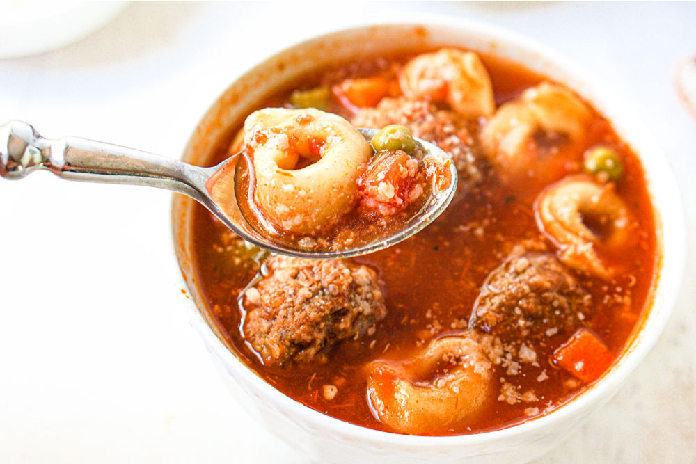 spoonful of tortellini and meatball vegetable soup