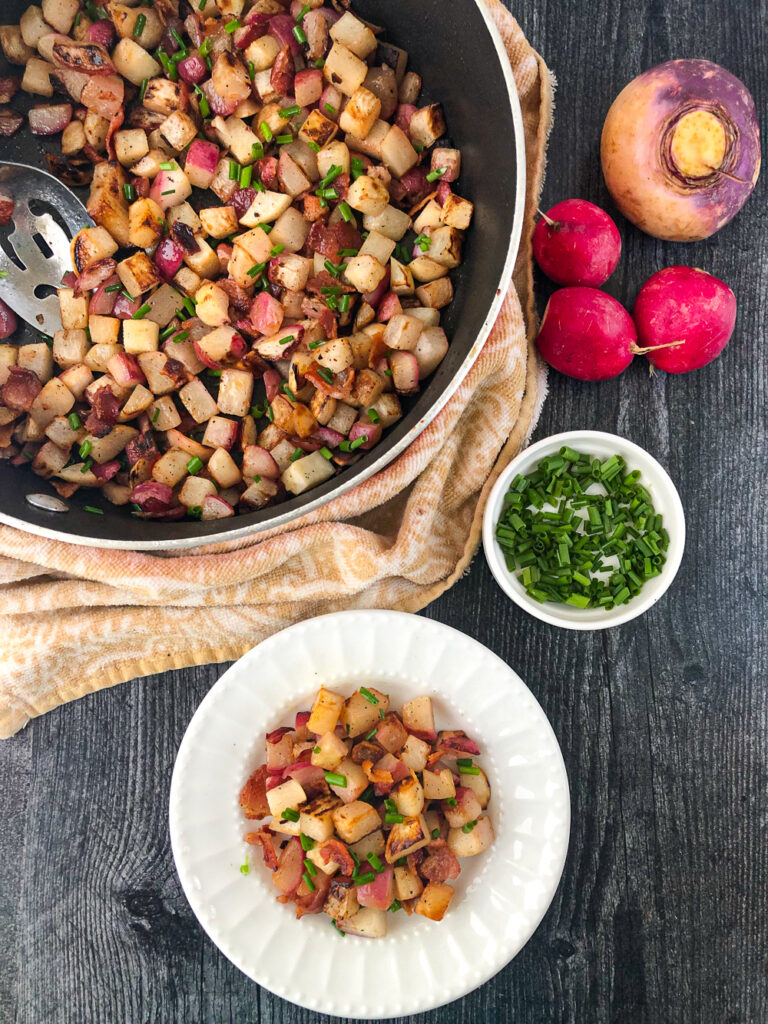 pan and white dish with fried turnips and with fresh radishes and turnips and chips along side