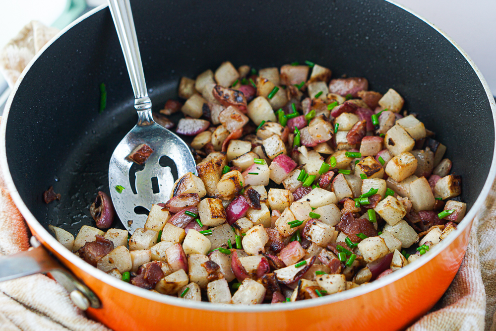 orange pan with keto has browns with silver spoon and chives