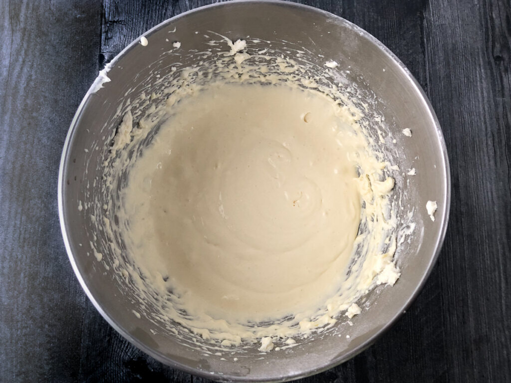 silver mixing bowl with cream cheese mixture