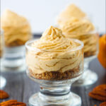 glass jars or no bake keto pumpkin cheesecake and pecans with nuts