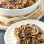 white plate with keto beef stroganoff made in the slow cooker with text