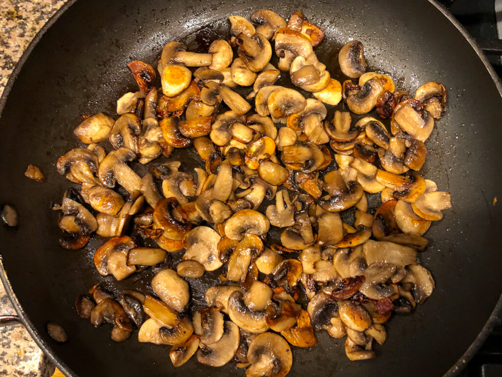 skillet with browned butter mushrooms
