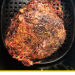air fryer basket with roasted lamb and text