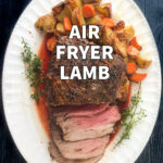 white platter with air fryer lamb roast with potatoes and carrots and text