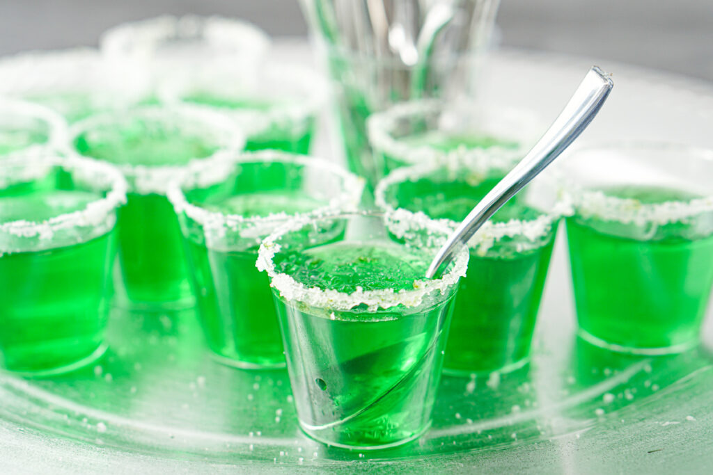 closeup of a jello shots with a spoon in one