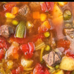 closeup of Instant Pot vegetable soup with beef chunks and text