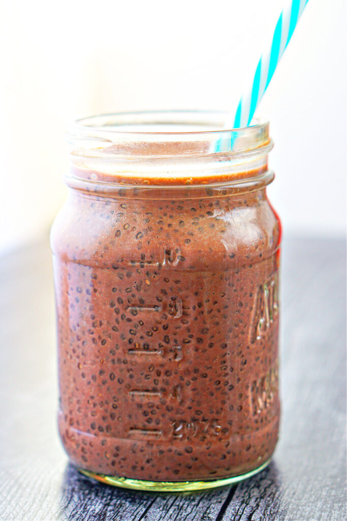 large glass jar with healthy chia drink from chocolate milk 