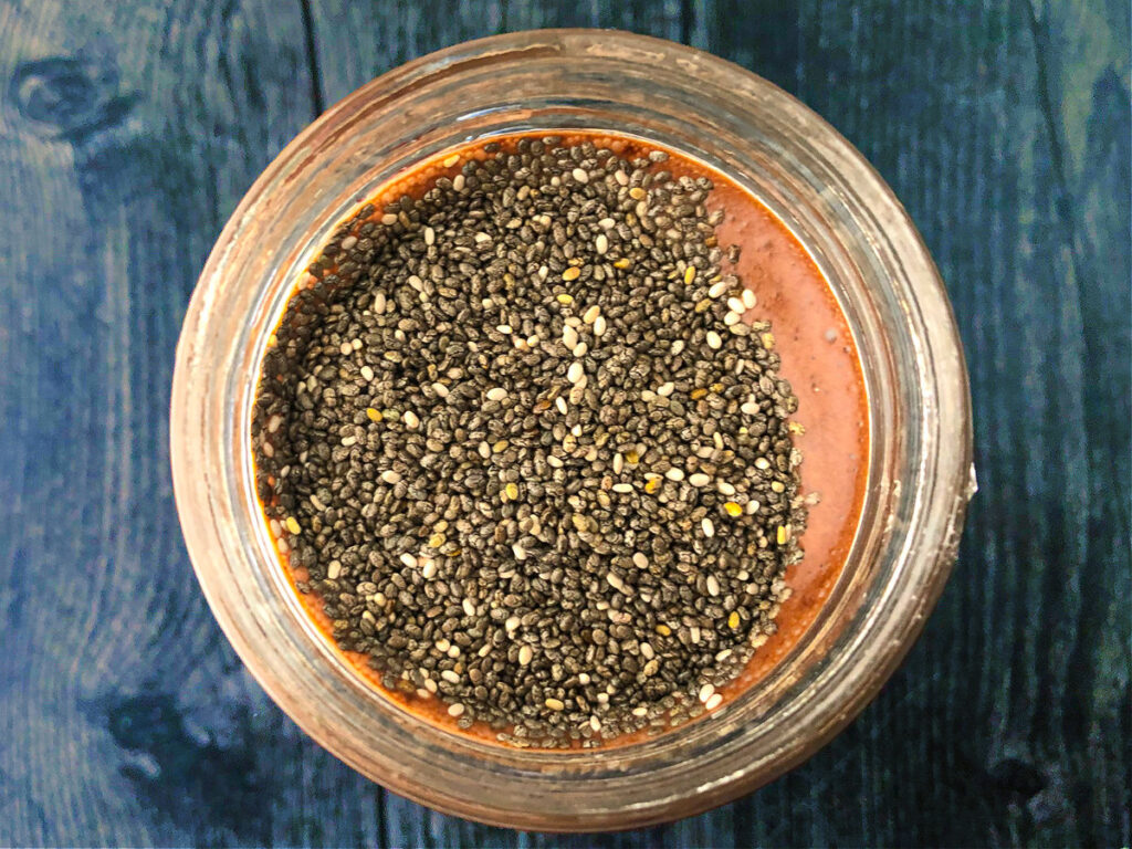 aerial view of low carb chocolate drink with chia seeds not yet mixed in