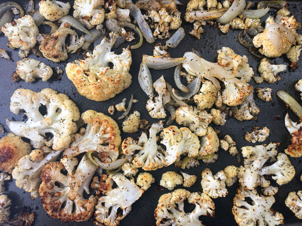baking sheet with roasted cauliflower and onions