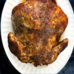 white platter with slow cooker roasted whole chicken and text