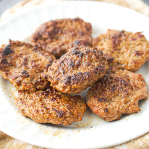 white plate with ground turkey sausage patties