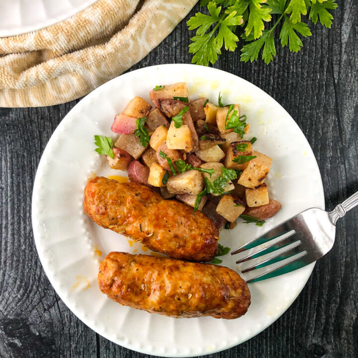 white plate with homemade Itlalian sausage and turnip hash and a fork