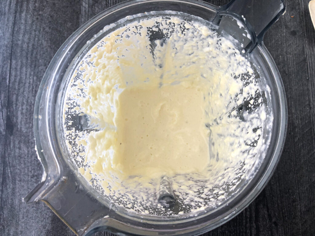 blender with creamy shake mixture