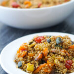 bowl and plate with warm quinoa salad with roasted veggies and text