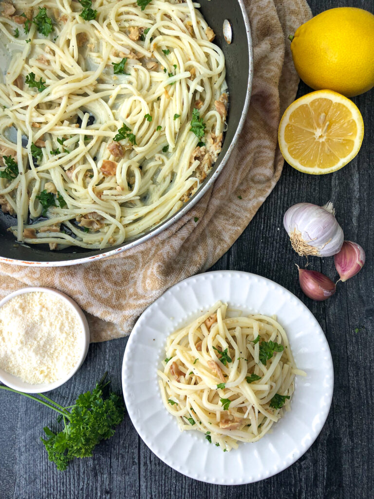 pan and plate with low carb linguine with clams and fresh lemons, garlic and parsley