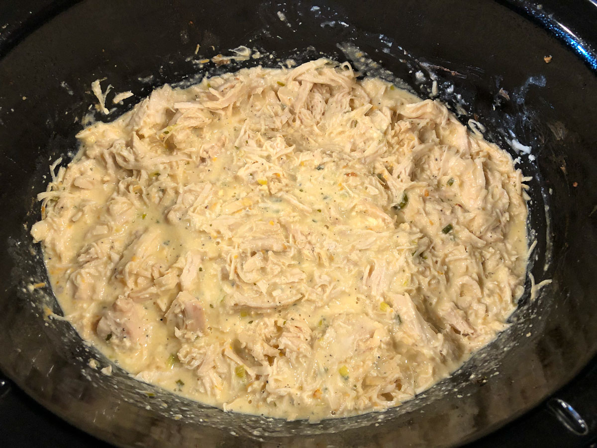 shredded cooked chicken in the sauce