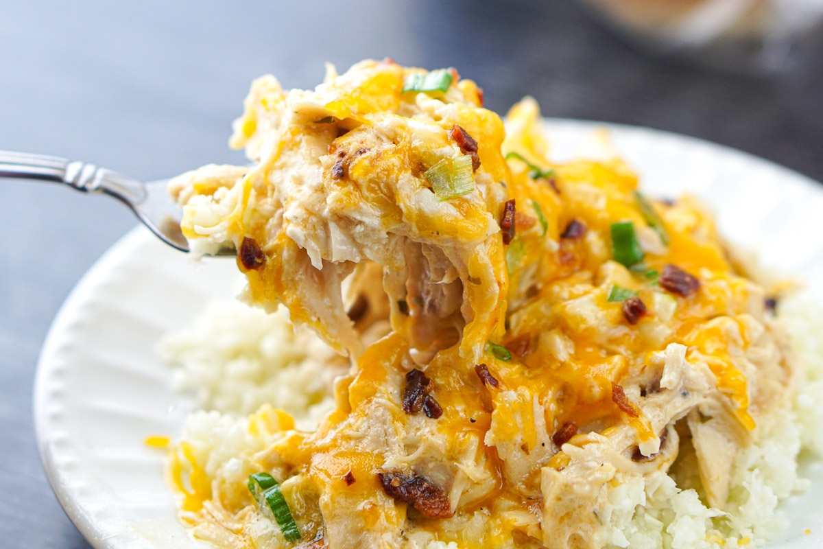 closeup of a forkful of the cheesy chicken ranch casserole