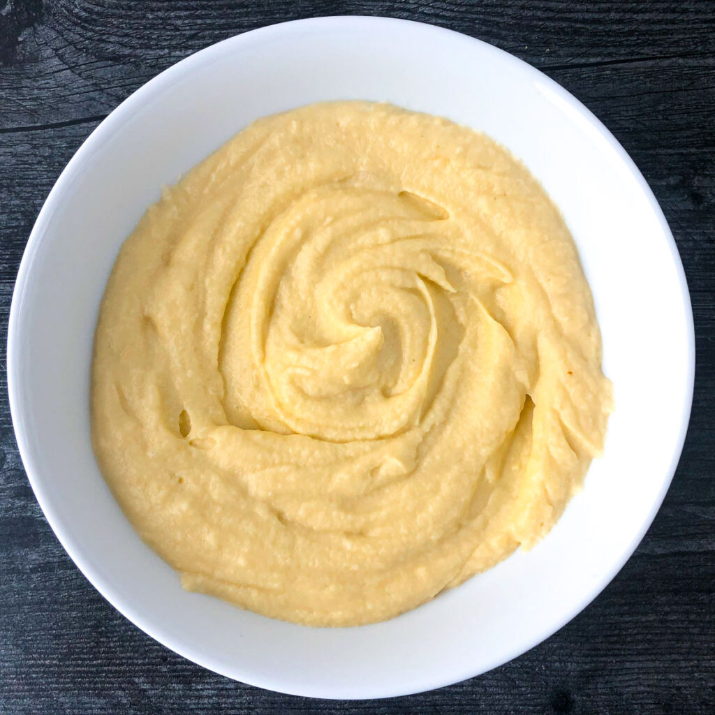 white bowl with keto cheddar cauliflower mash