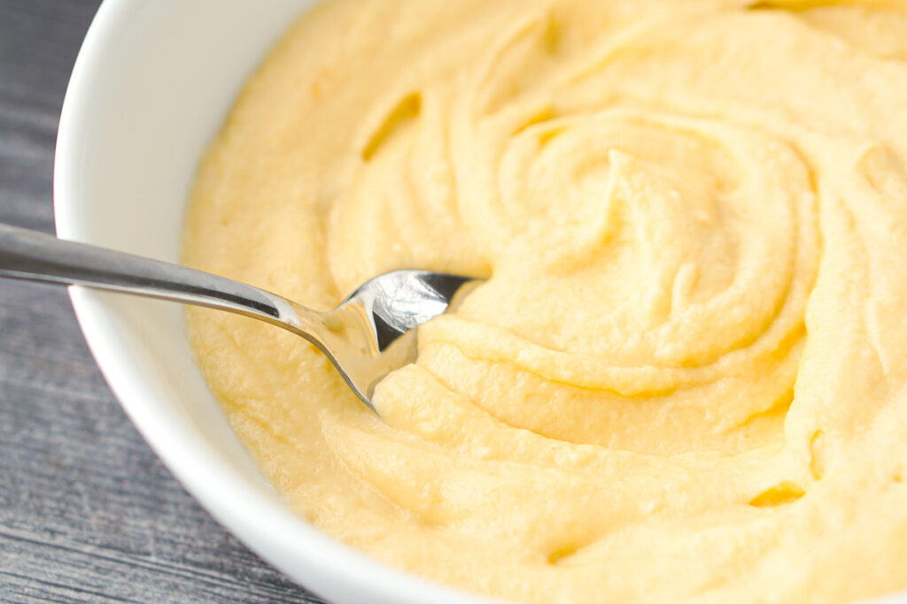 closeup of a spoon in low carb mashed cauliflower