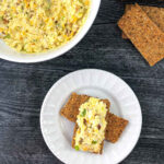 white bowl and plate with low carb egg salad and crisp breads and text