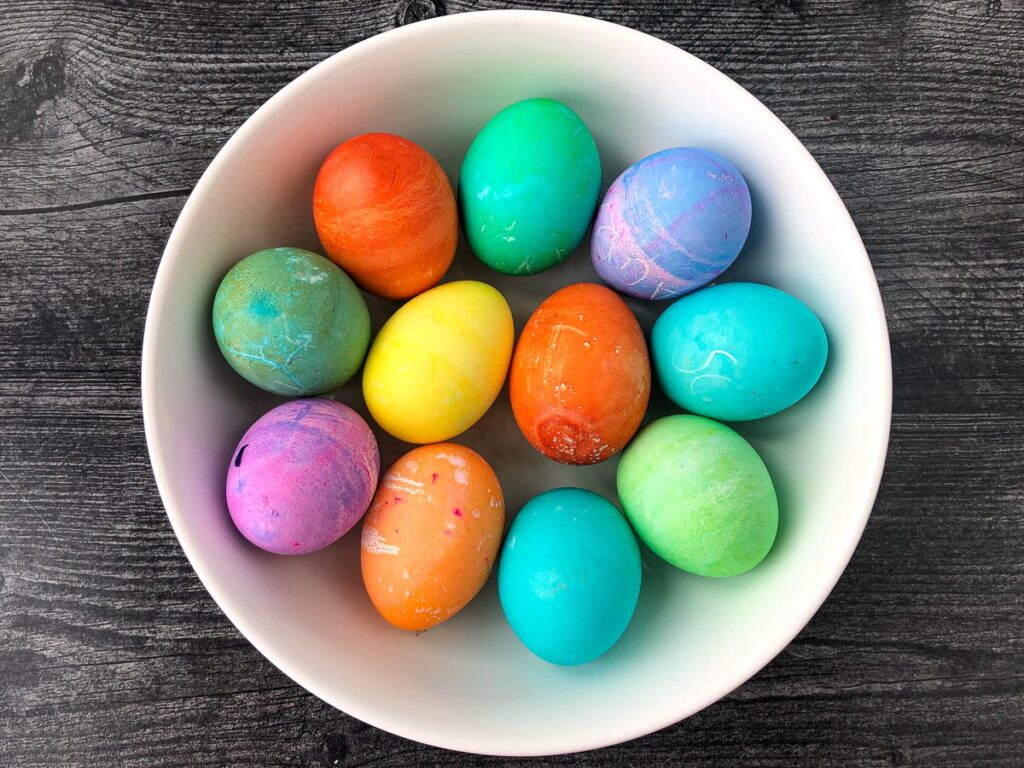 white bowl with colored Easter eggs