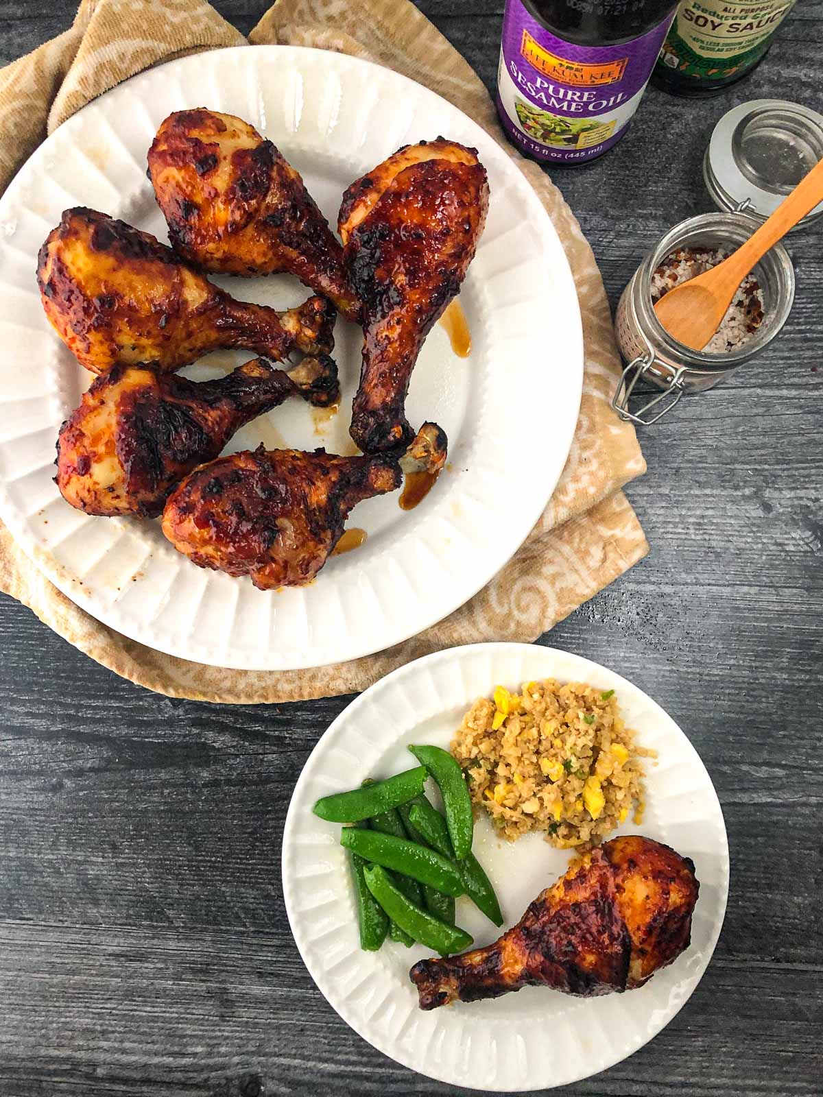 aerial view of white plate with air fryer sticky keto drumsticks