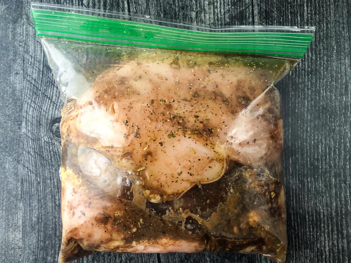 baggie with marinated raw chicken breasts