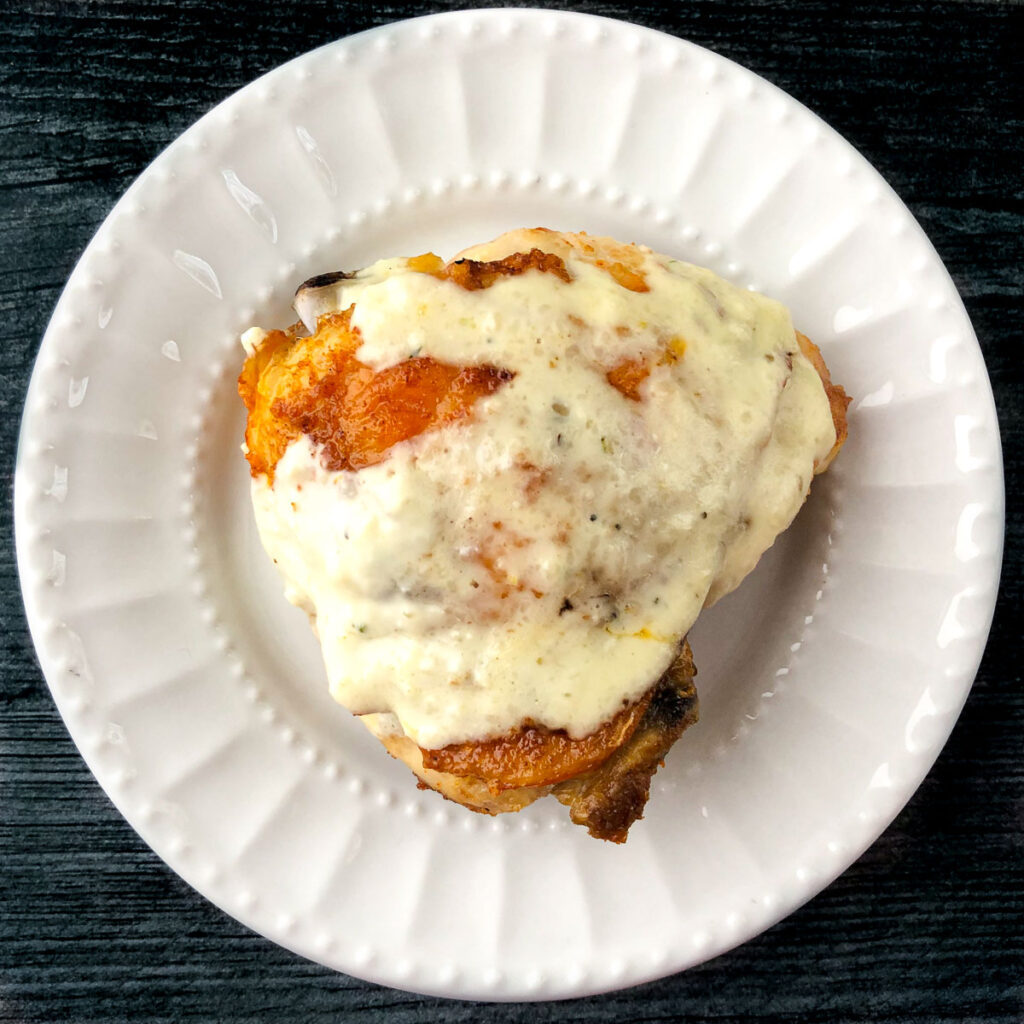 Air Fryer Chicken Thighs Keto Dinner with Creamy Parmesan Garlic Sauce