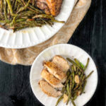 white plates with balsamic marinated chicken and green beans made in the air fryer and text